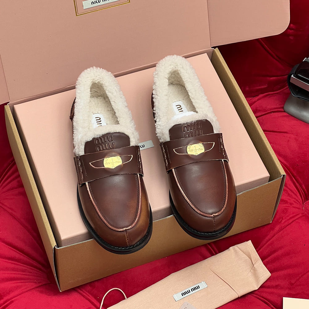M1um1u Bleached leather and shearling penny loafers