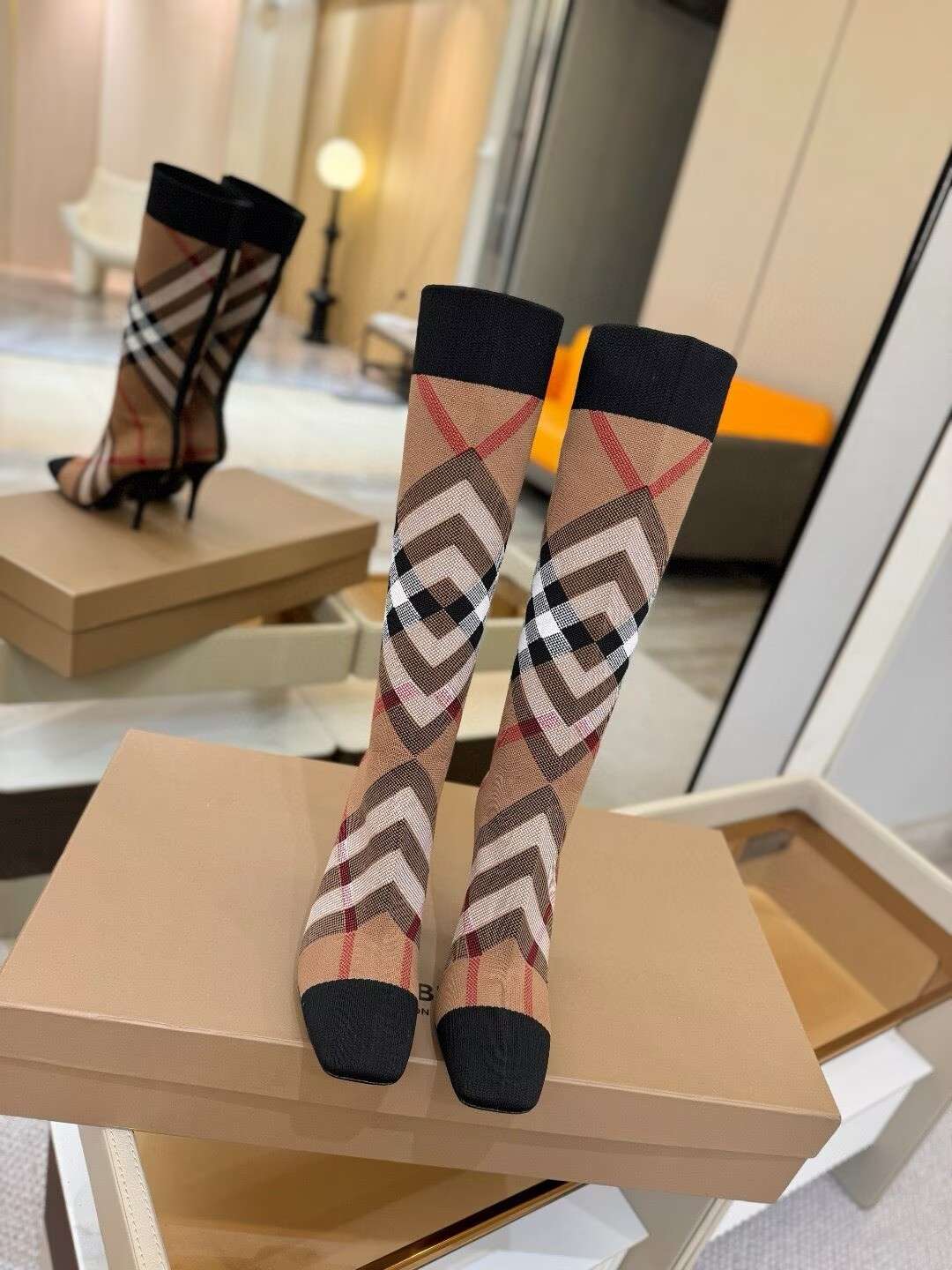 ua Bv*b*rry check high boots
