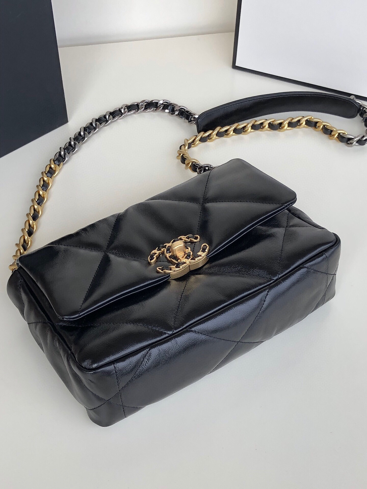 Ch**el 19 HANDBAG Shiny Leather, Gold-Tone, Silver-Tone & Ruthenium-Finish Metal Black 6.2 × 10.1 × 3.5 in