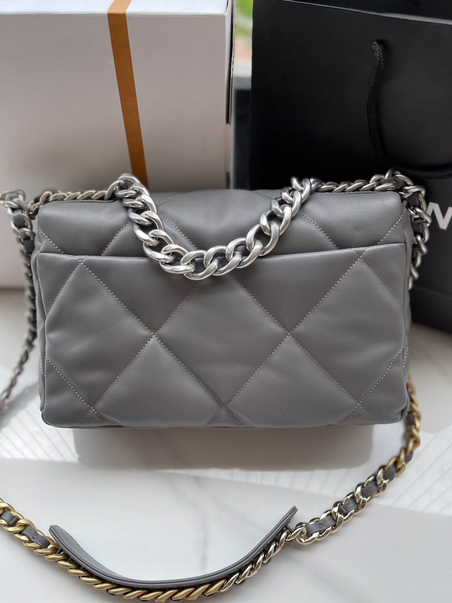 Ch**el 19 LARGE HANDBAG Shiny Leather, Gold-Tone, Silver-Tone & Ruthenium-Finish Metal Gray 7.8 × 11.7 × 3.9 in