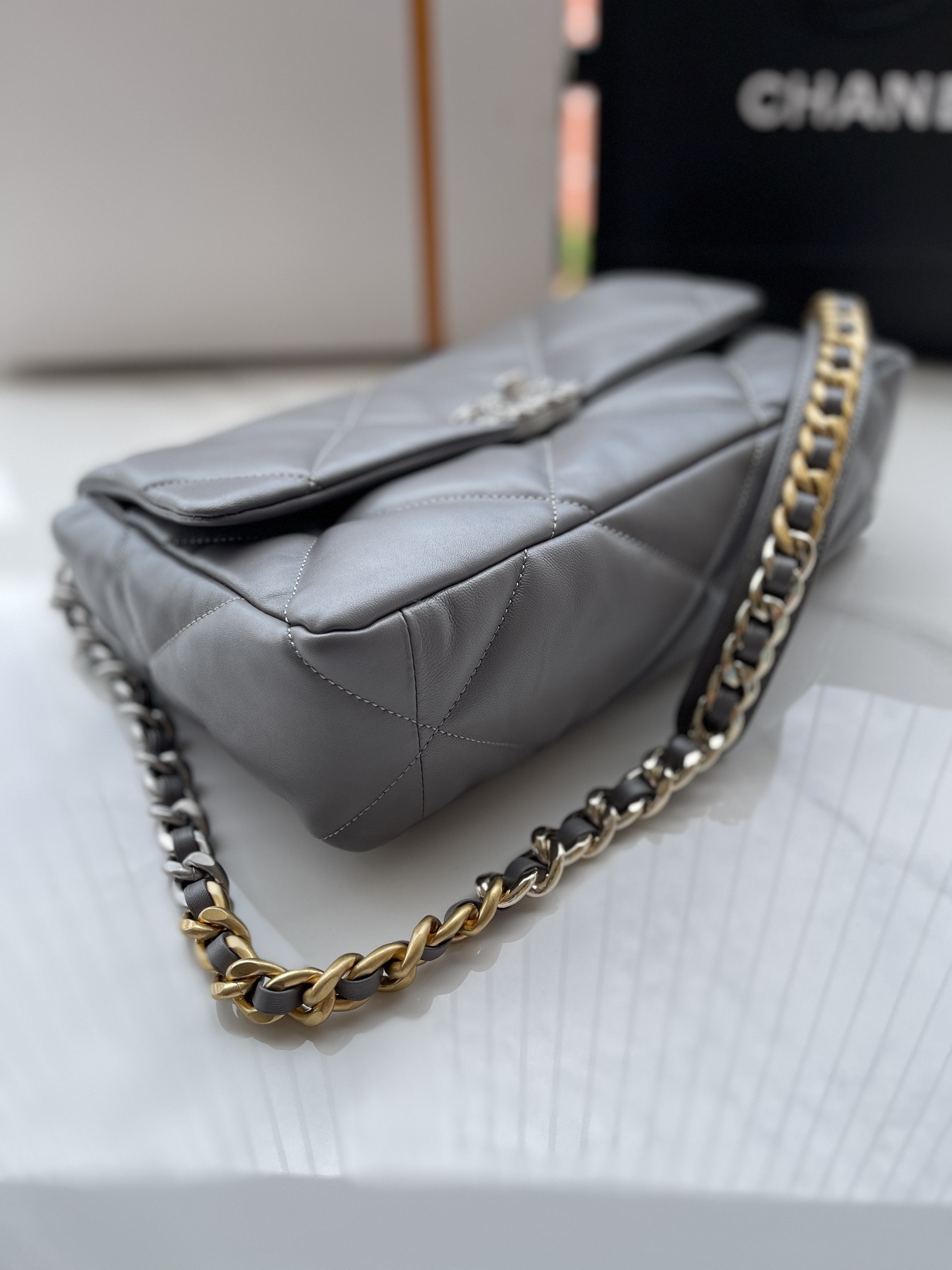 Ch**el 19 LARGE HANDBAG Shiny Leather, Gold-Tone, Silver-Tone & Ruthenium-Finish Metal Gray 7.8 × 11.7 × 3.9 in